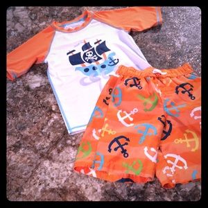 Boys 5T swim trunks and swim shirt set.